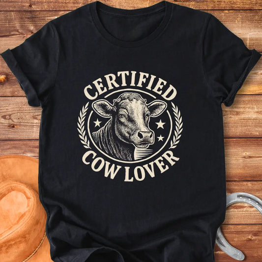 Vintage dark t-shirt with a detailed illustration of a cow and text that says 'Certified Cow Lover'.