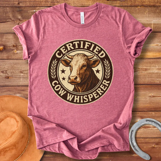 Certified Cow Whisperer T-Shirt design featuring a detailed cow face within a circular badge.