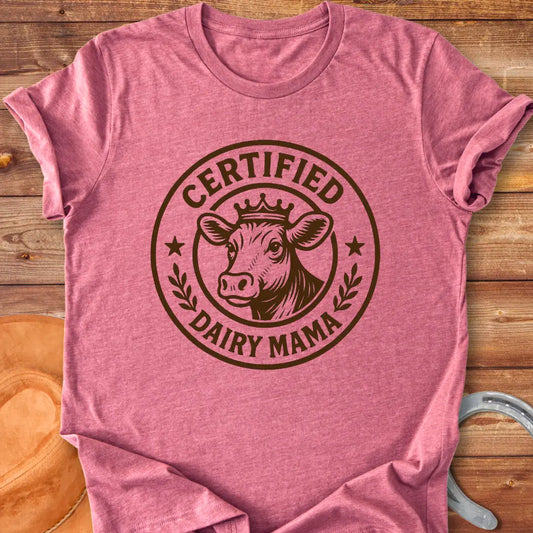 Certified Dairy Mama t-shirt design featuring a cow with a crown inside a circular logo.