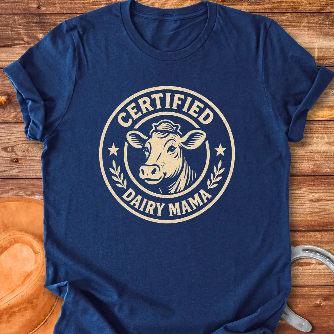 Certified Dairy Mama t-shirt design featuring a cow with a crown inside a circular logo.