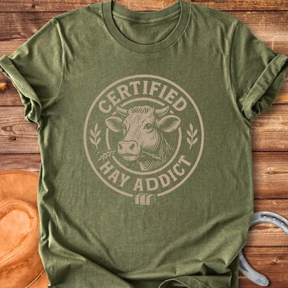 Certified Hay Addict T-Shirt featuring a cow illustration within a circle with text