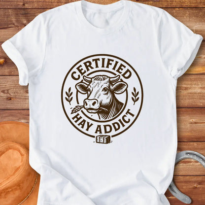 Certified Hay Addict T-Shirt featuring a cow illustration within a circle with text