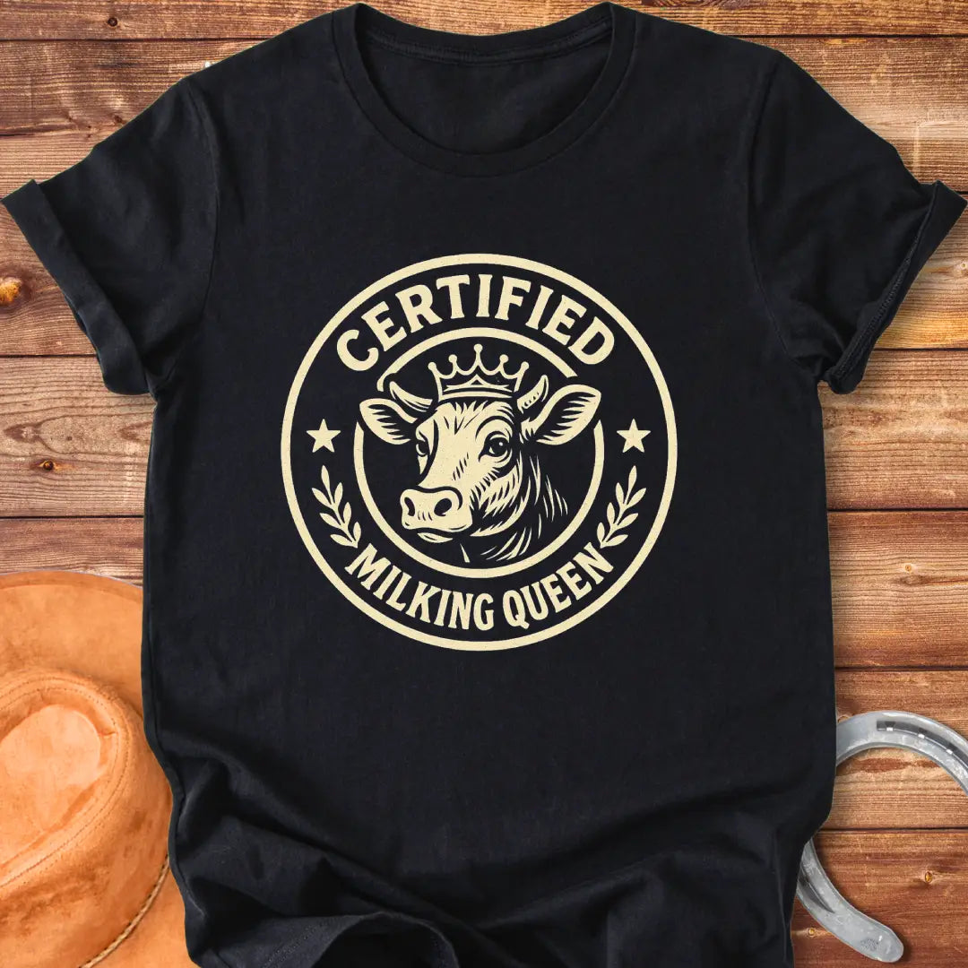 Certified Milking Queen T-Shirt design with a cow wearing a crown, and the words 'Certified Milking Queen' in a circular emblem.