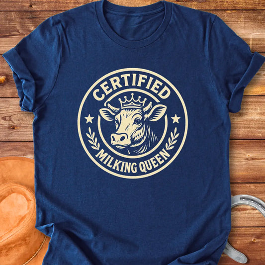 Certified Milking Queen T-Shirt design with a cow wearing a crown, and the words 'Certified Milking Queen' in a circular emblem.