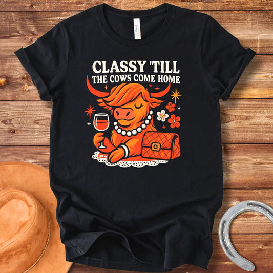 A stylish cow wearing a pearl necklace and holding a glass of wine, with the words "Classy 'Till The Cows Come Home".