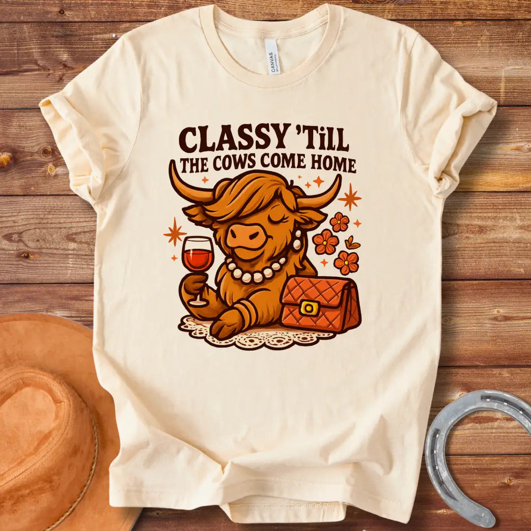 A stylish cow wearing a pearl necklace and holding a glass of wine, with the words "Classy 'Till The Cows Come Home".