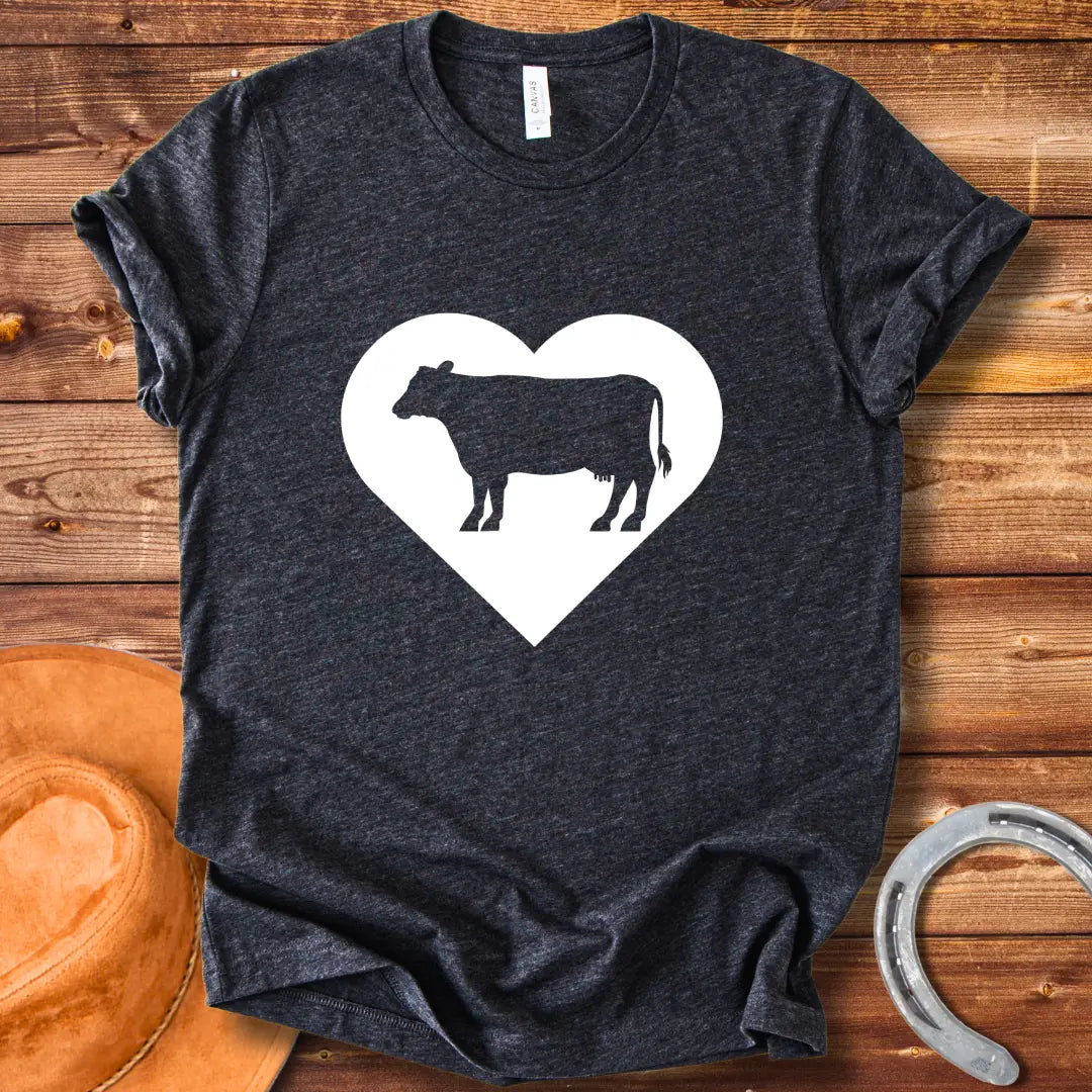 Black silhouette of a cow inside a grey heart on a black background. Perfect for cow lovers.