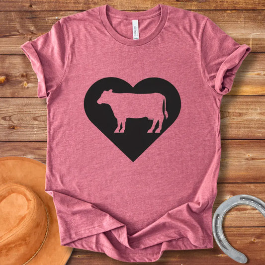 Black silhouette of a cow inside a grey heart on a black background. Perfect for cow lovers.