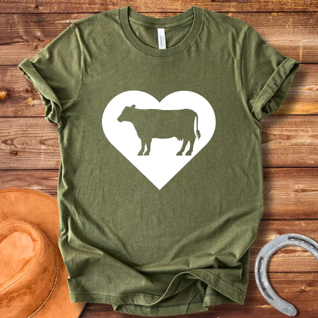 Black silhouette of a cow inside a grey heart on a black background. Perfect for cow lovers.