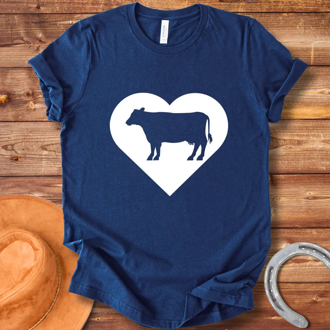 Black silhouette of a cow inside a grey heart on a black background. Perfect for cow lovers.