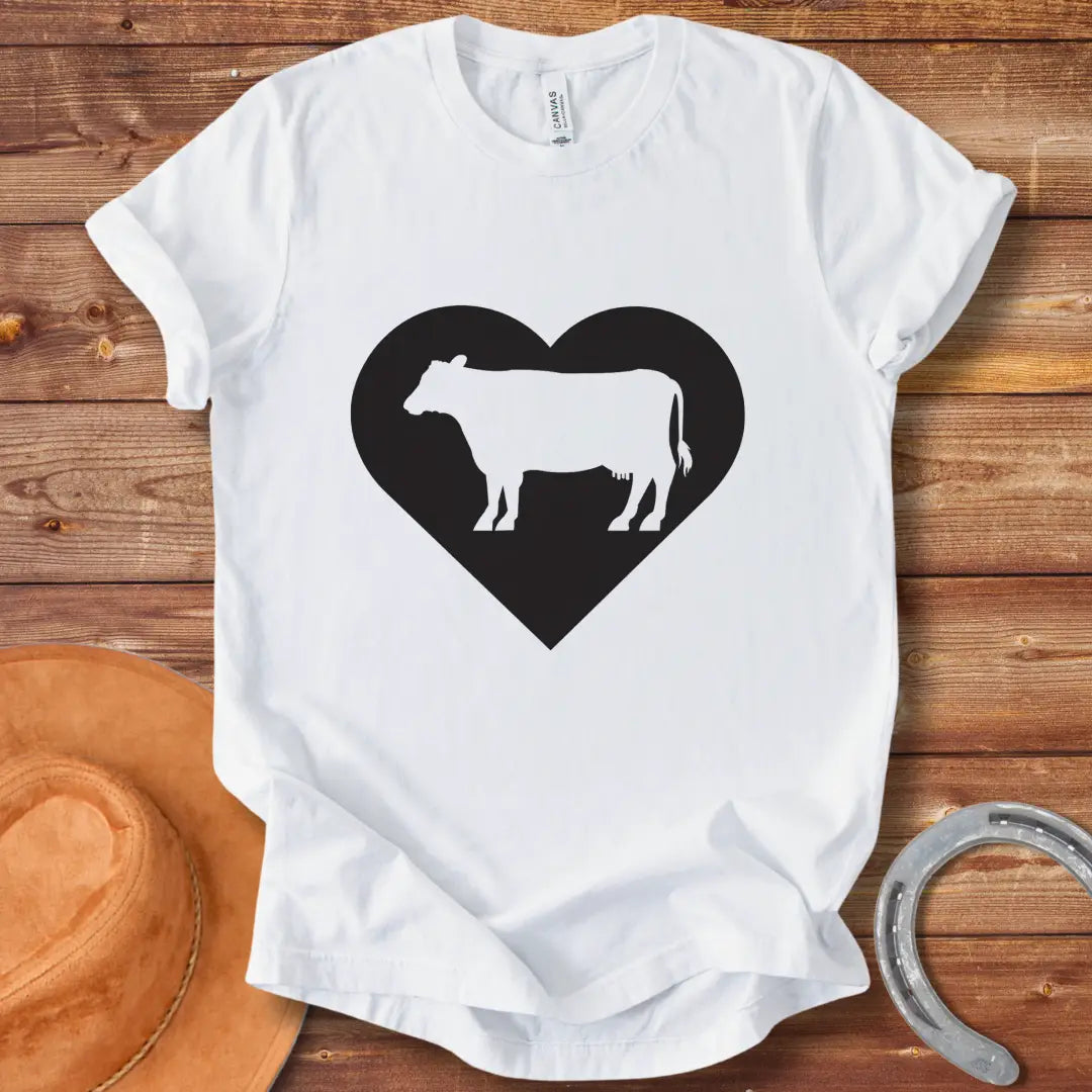 Black silhouette of a cow inside a grey heart on a black background. Perfect for cow lovers.