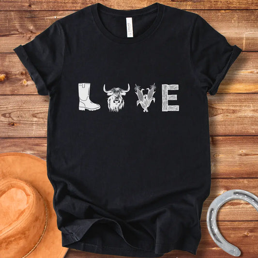 Cow Love T-Shirt featuring a design with the word 'LOVE' stylized with farm and plant imagery on a black background.