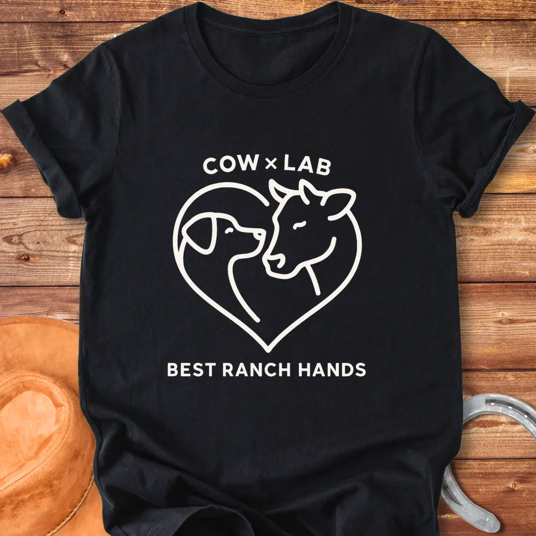 Cow x Lab T-Shirt design featuring a cow and a dog embracing within a heart shape, with the words 'Best Ranch Hands' at the bottom.