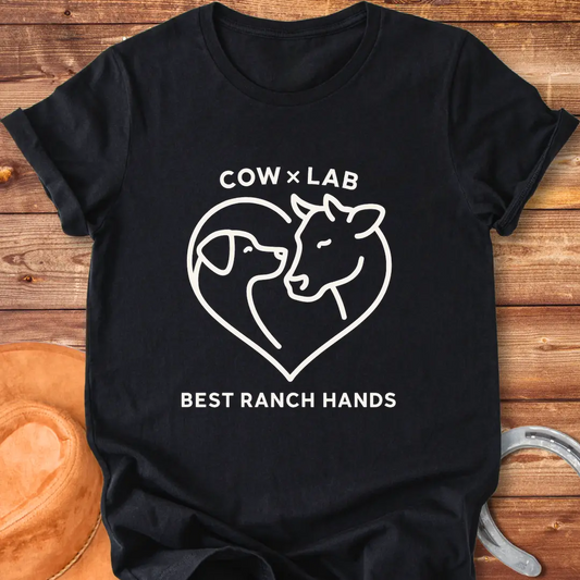 Cow x Lab T-Shirt design featuring a cow and a dog embracing within a heart shape, with the words 'Best Ranch Hands' at the bottom.