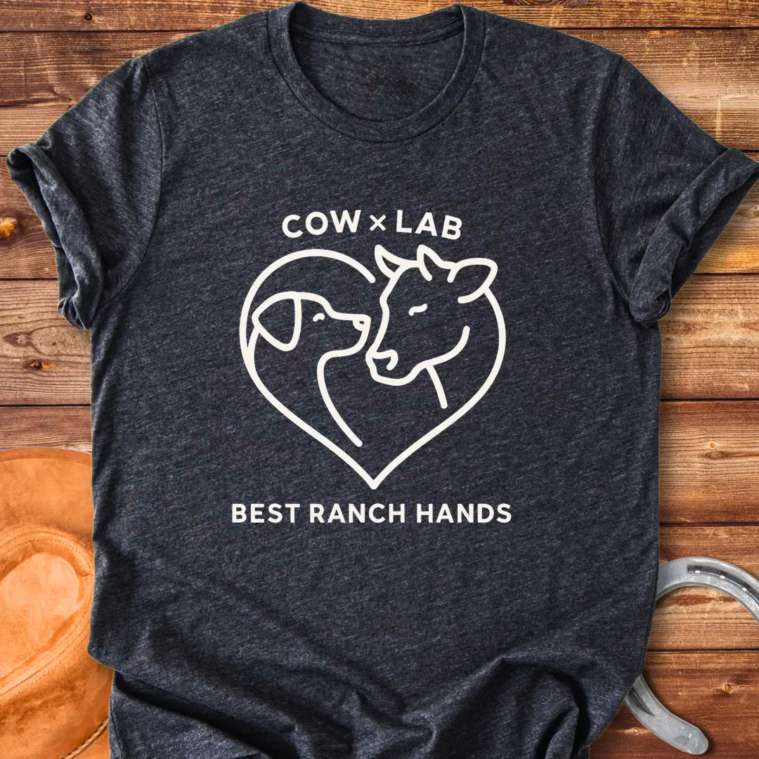 Cow x Lab T-Shirt design featuring a cow and a dog embracing within a heart shape, with the words 'Best Ranch Hands' at the bottom.
