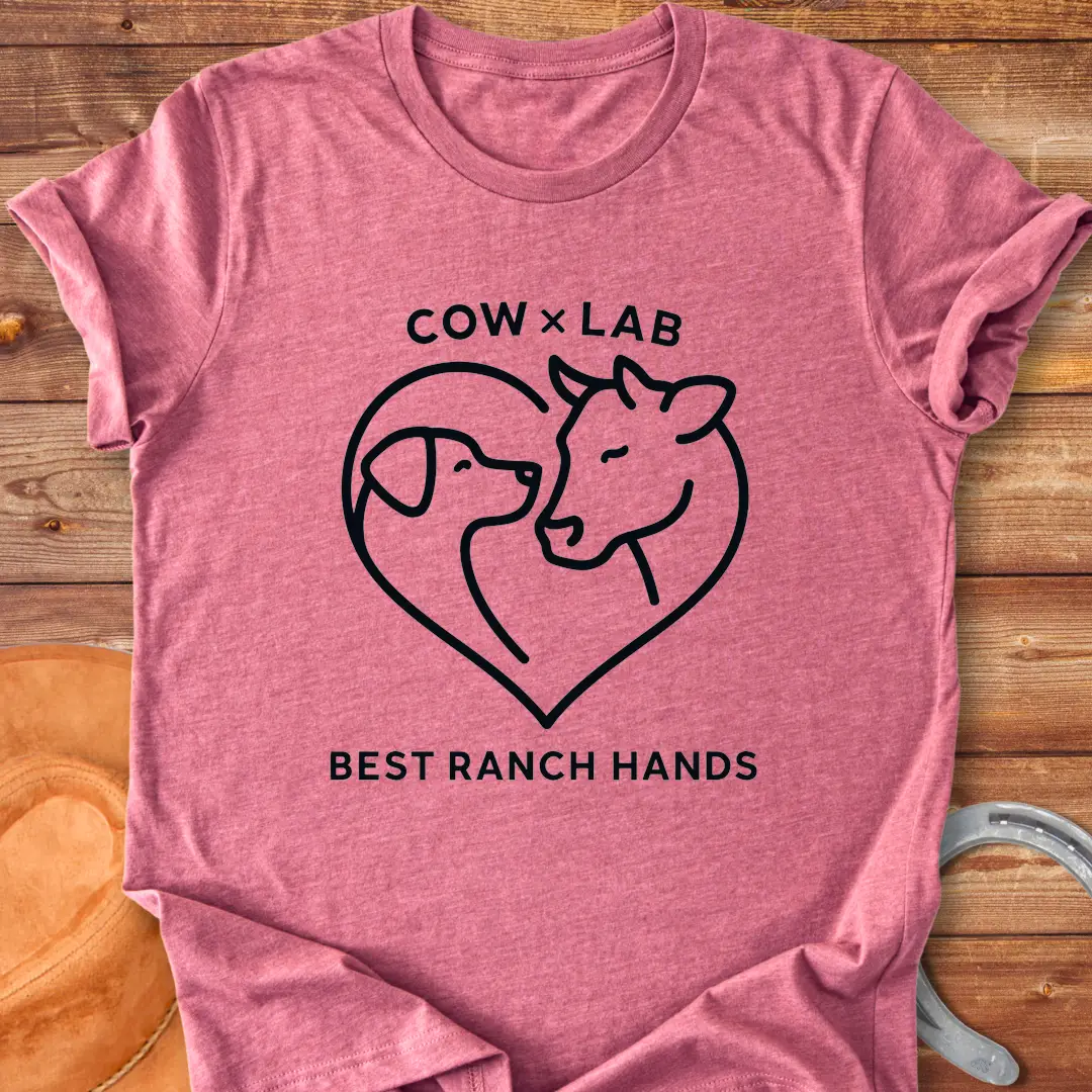 Cow x Lab T-Shirt design featuring a cow and a dog embracing within a heart shape, with the words 'Best Ranch Hands' at the bottom.