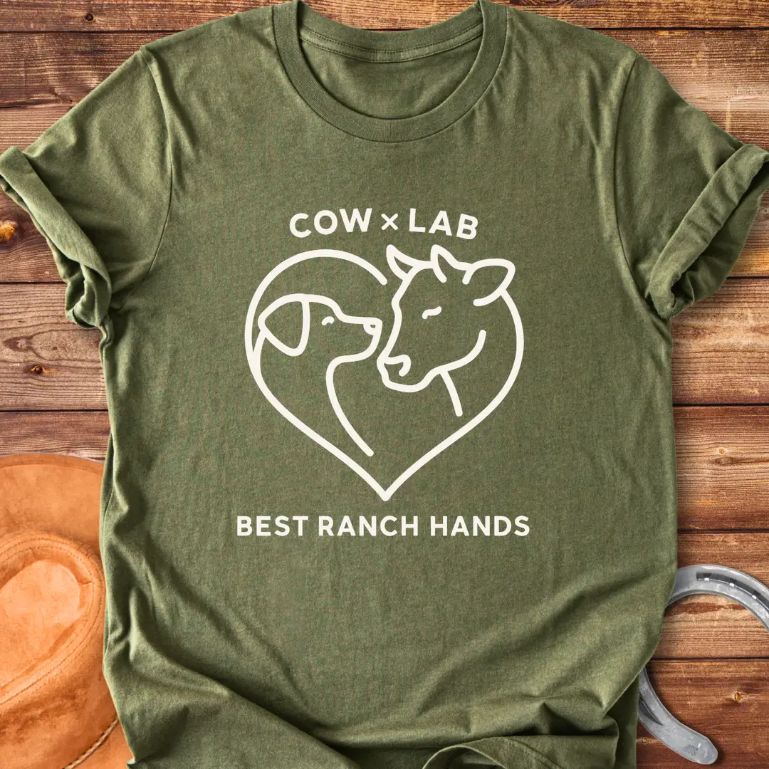 Cow x Lab T-Shirt design featuring a cow and a dog embracing within a heart shape, with the words 'Best Ranch Hands' at the bottom.