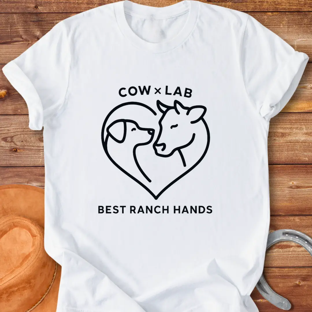 Cow x Lab T-Shirt design featuring a cow and a dog embracing within a heart shape, with the words 'Best Ranch Hands' at the bottom.