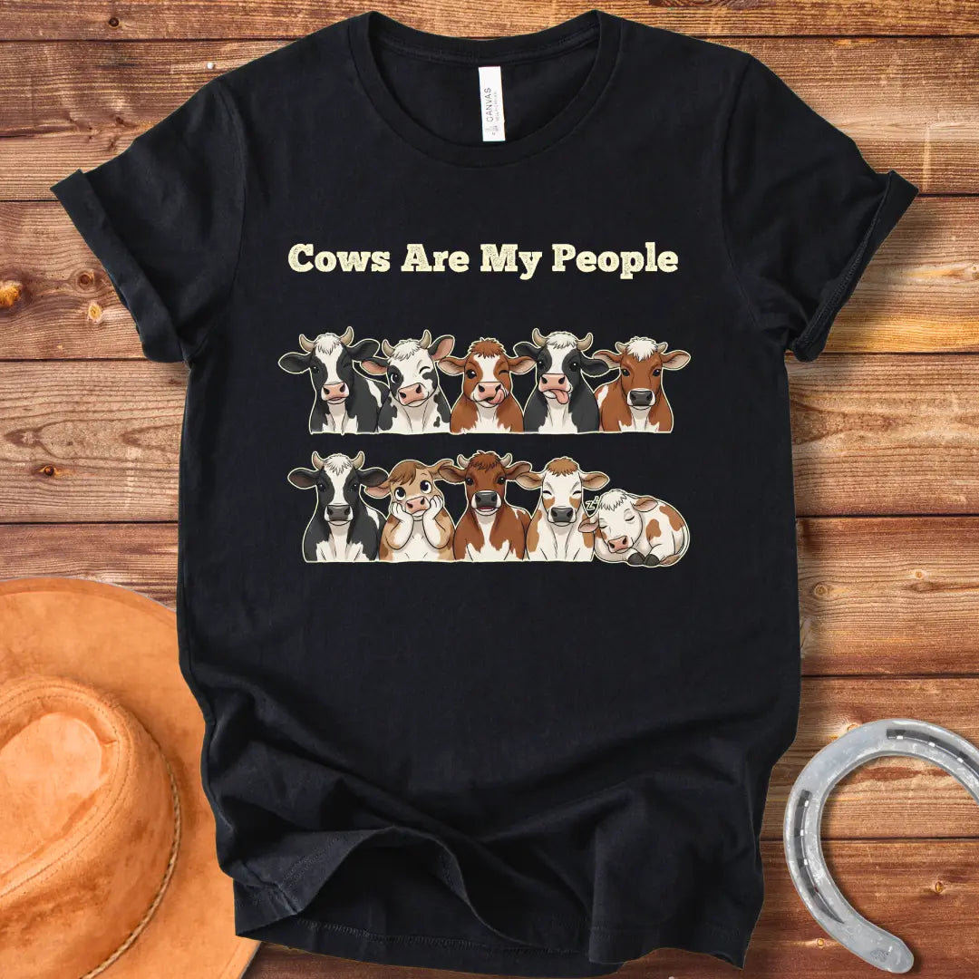 Cows Are My People T-shirt featuring a design of cartoon cows winking and smiling