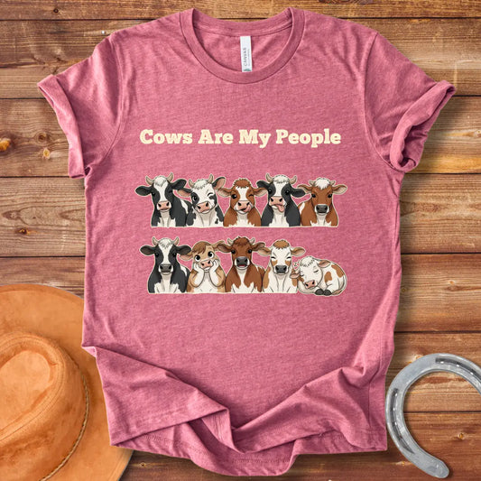 Cows Are My People T-shirt featuring a design of cartoon cows winking and smiling