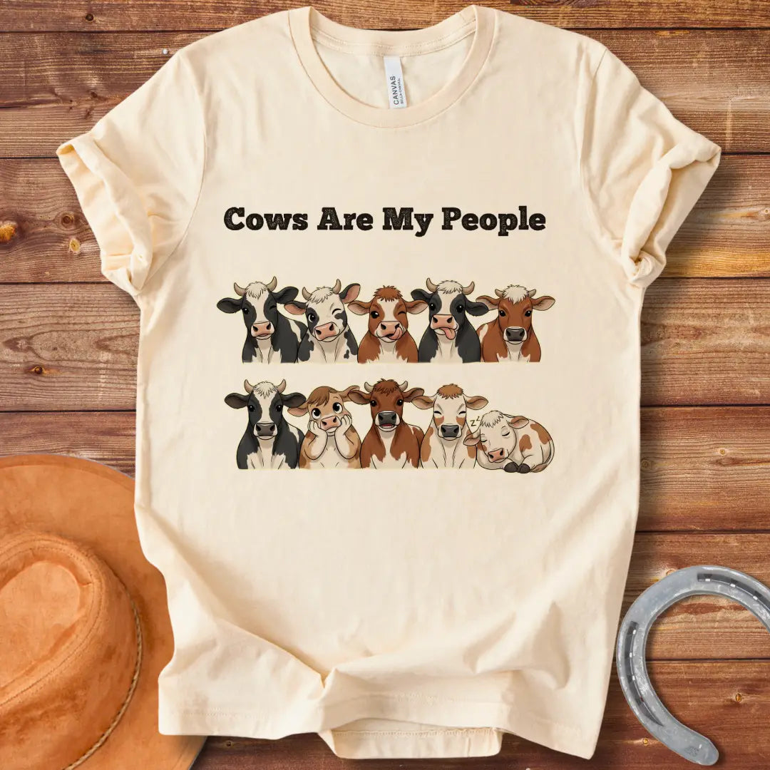 Cows Are My People T-shirt featuring a design of cartoon cows winking and smiling