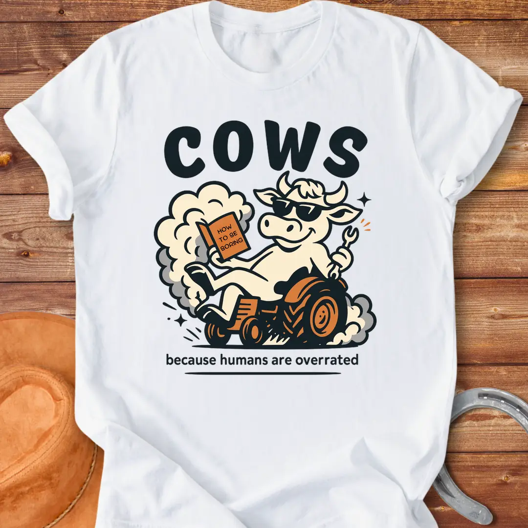 Funny t-shirt design featuring a cool cow reading a book on a tractor with the phrase 'Cows Because Humans Overrated'