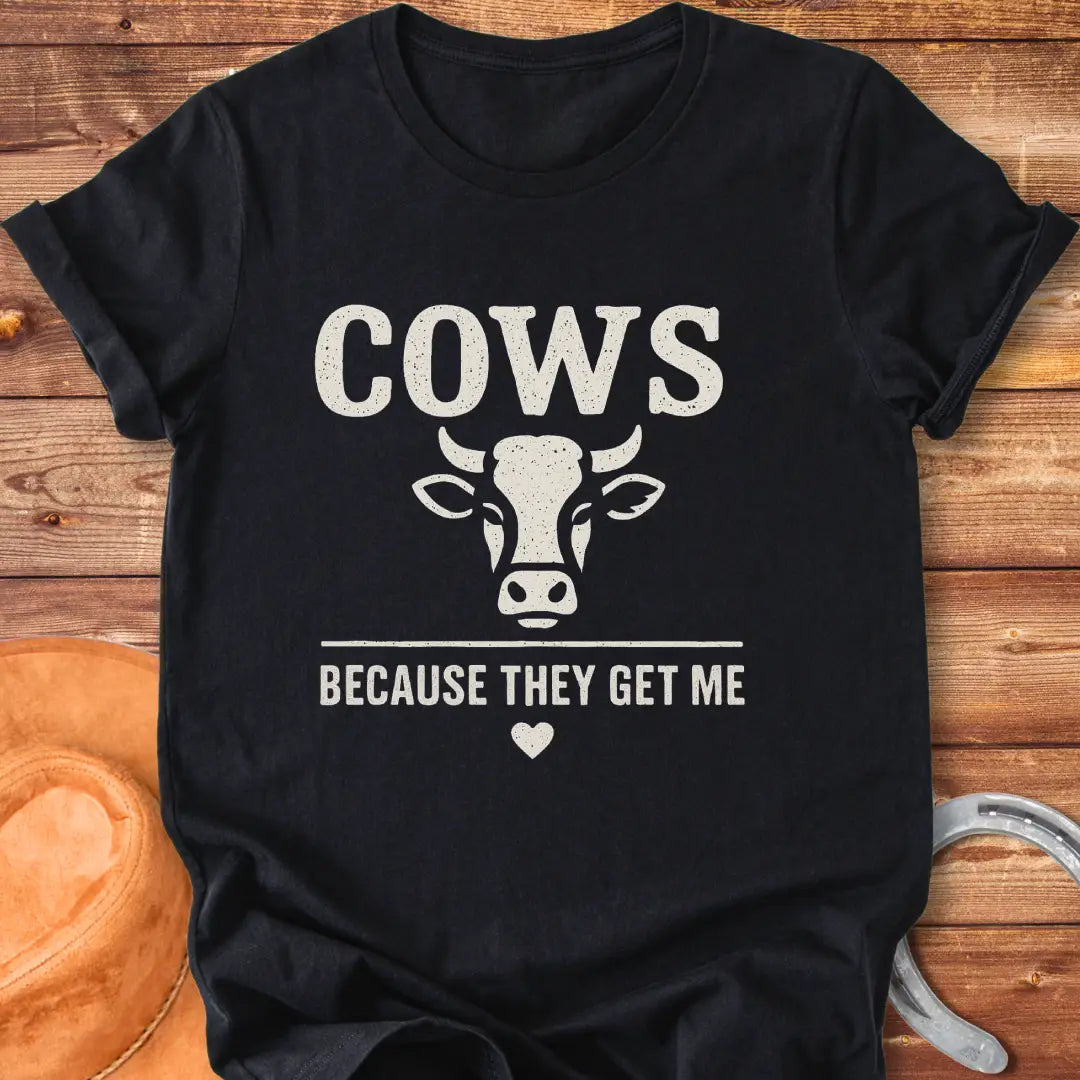 Cow face t-shirt design with the words 'Cows Because They Get Me' underneath.