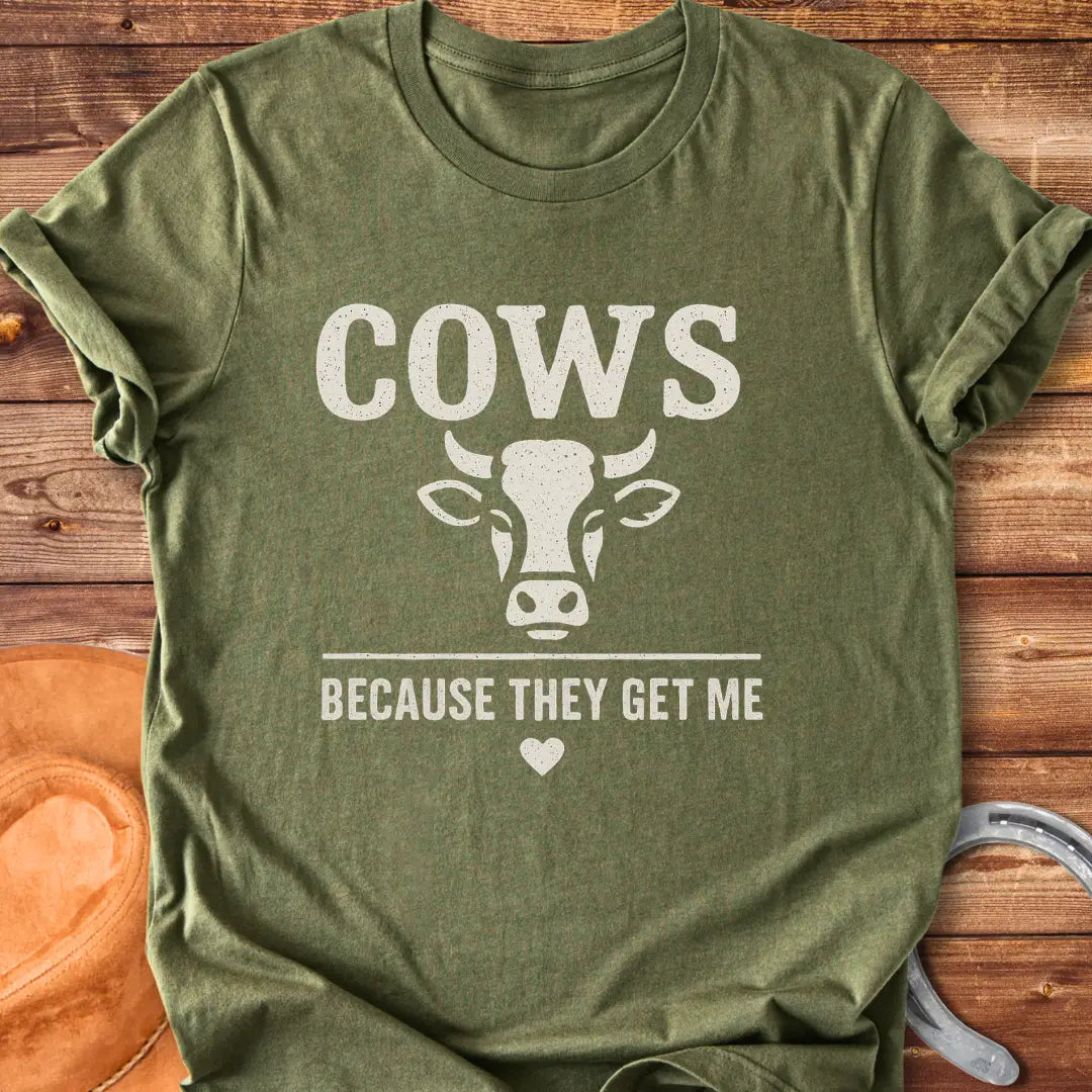 Cow face t-shirt design with the words 'Cows Because They Get Me' underneath.