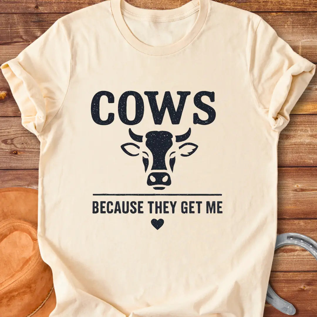 Cow face t-shirt design with the words 'Cows Because They Get Me' underneath.