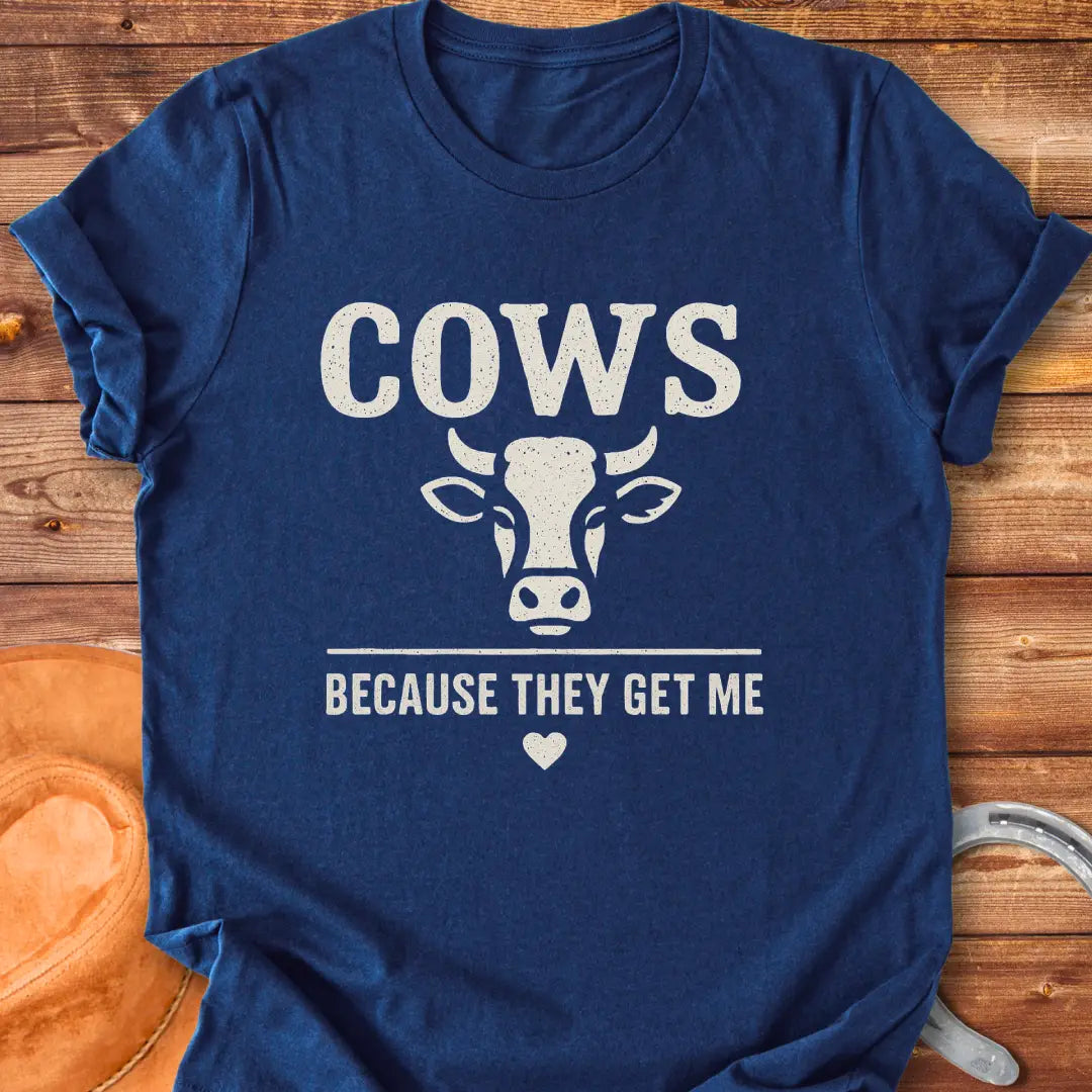 Cow face t-shirt design with the words 'Cows Because They Get Me' underneath.