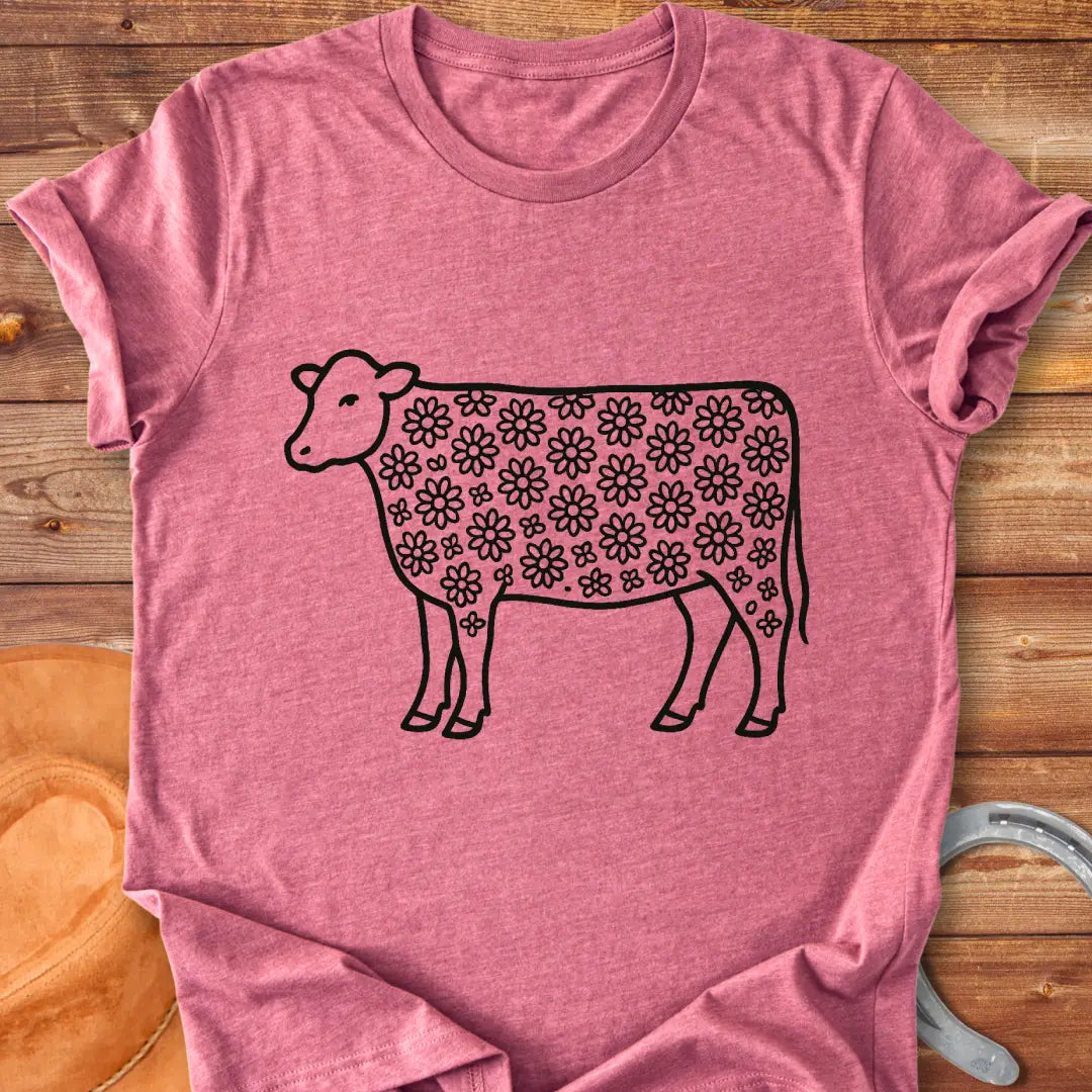 Line art illustration of a cow with a floral pattern filling the body