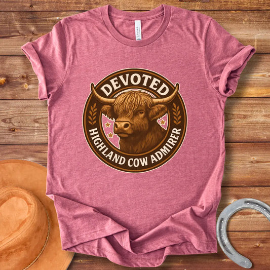Devoted Highland Cow Admirer T-Shirt design featuring a detailed illustration of a Highland cow's head inside a circular frame with text.