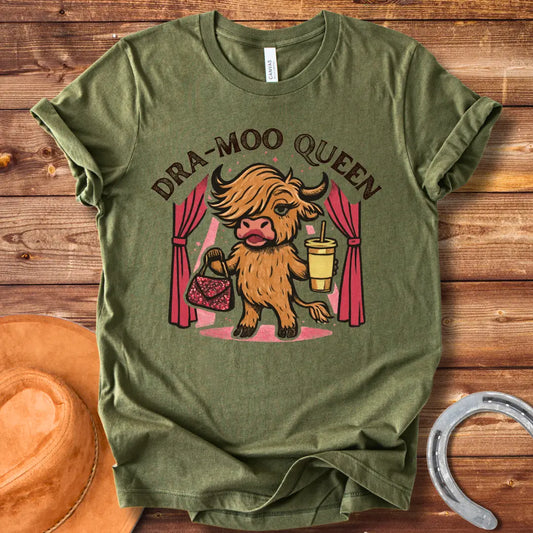 Illustration of a cow in a sassy pose holding a purse and a drink with the words Dra-Moo Queen above.