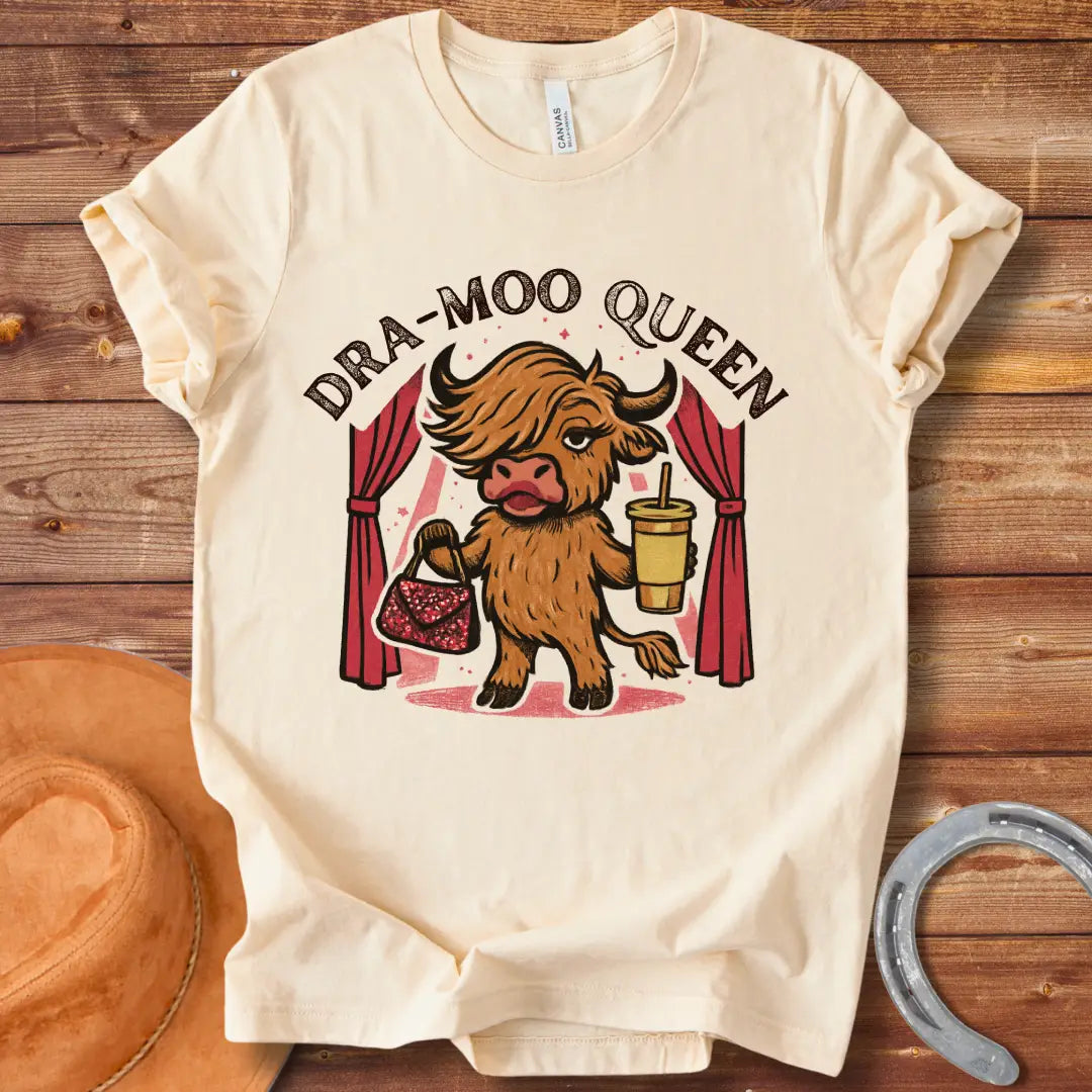 Illustration of a cow in a sassy pose holding a purse and a drink with the words Dra-Moo Queen above.