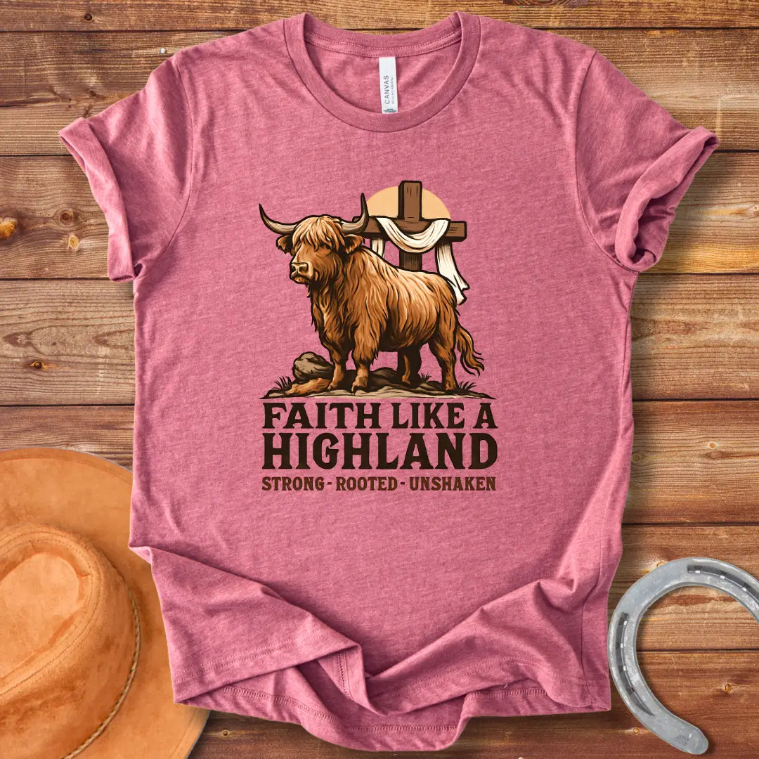 Highland cow t-shirt design with a cross and the words Faith Like A Highland. A brown cow stands in front of a cross.