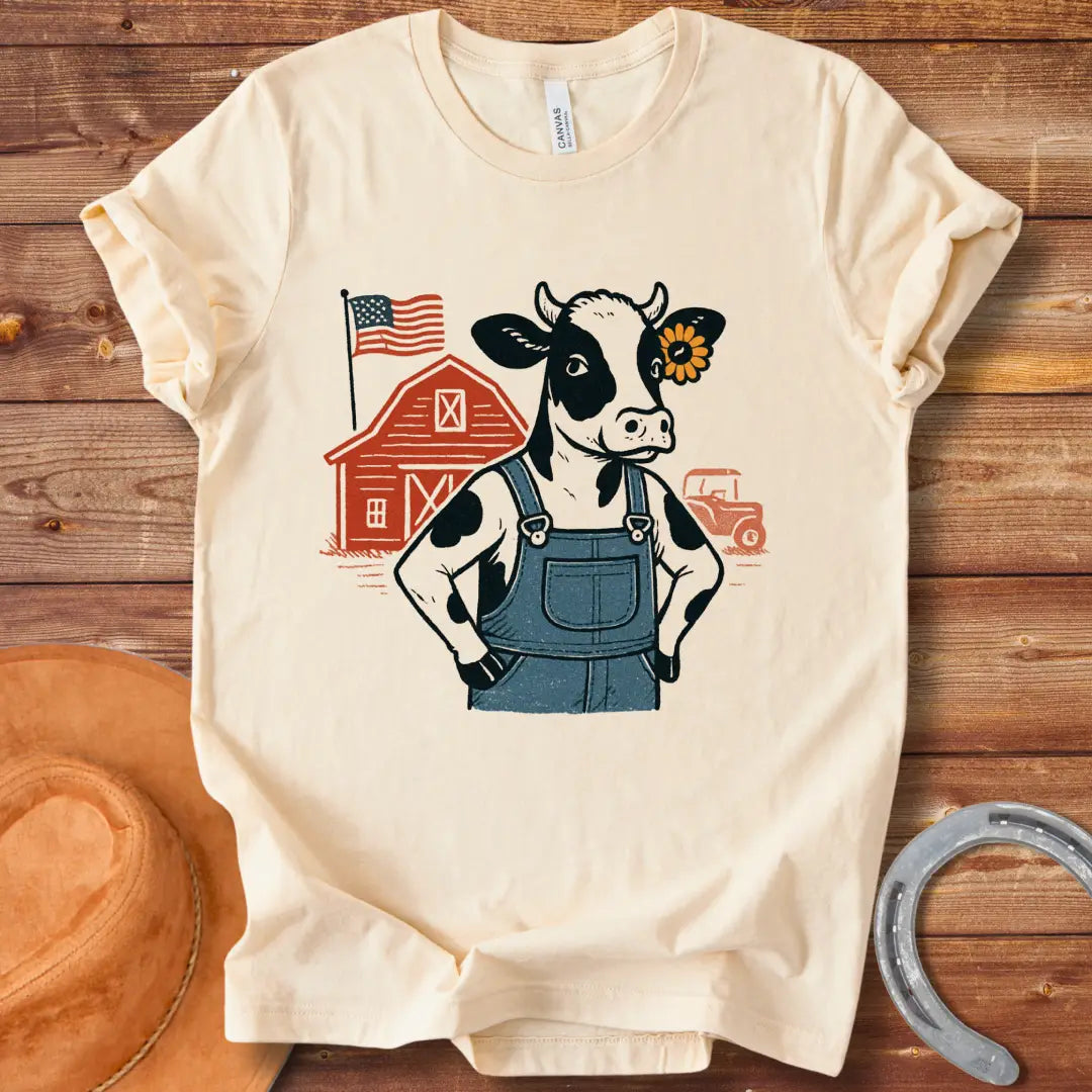 Farm Strong Moo T-Shirt design featuring a cow in overalls, a sunflower, a red barn, American flag, and a vintage truck.