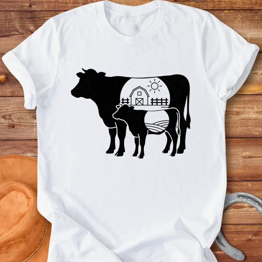 Farmstead Mama and Calf Silhouette T-Shirt featuring a silhouette of a mother cow and calf with a farm scene inside.