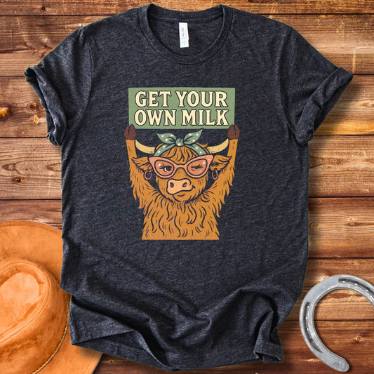 A sassy highland cow wearing sunglasses, holding a sign that reads 'Get Your Own Milk'