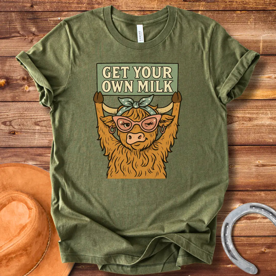 A sassy highland cow wearing sunglasses, holding a sign that reads 'Get Your Own Milk'