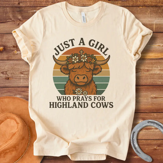 Girl praying for Highland cows t-shirt design featuring a Highland cow with a flower crown and the words 'Just a girl who prays for Highland cows'.