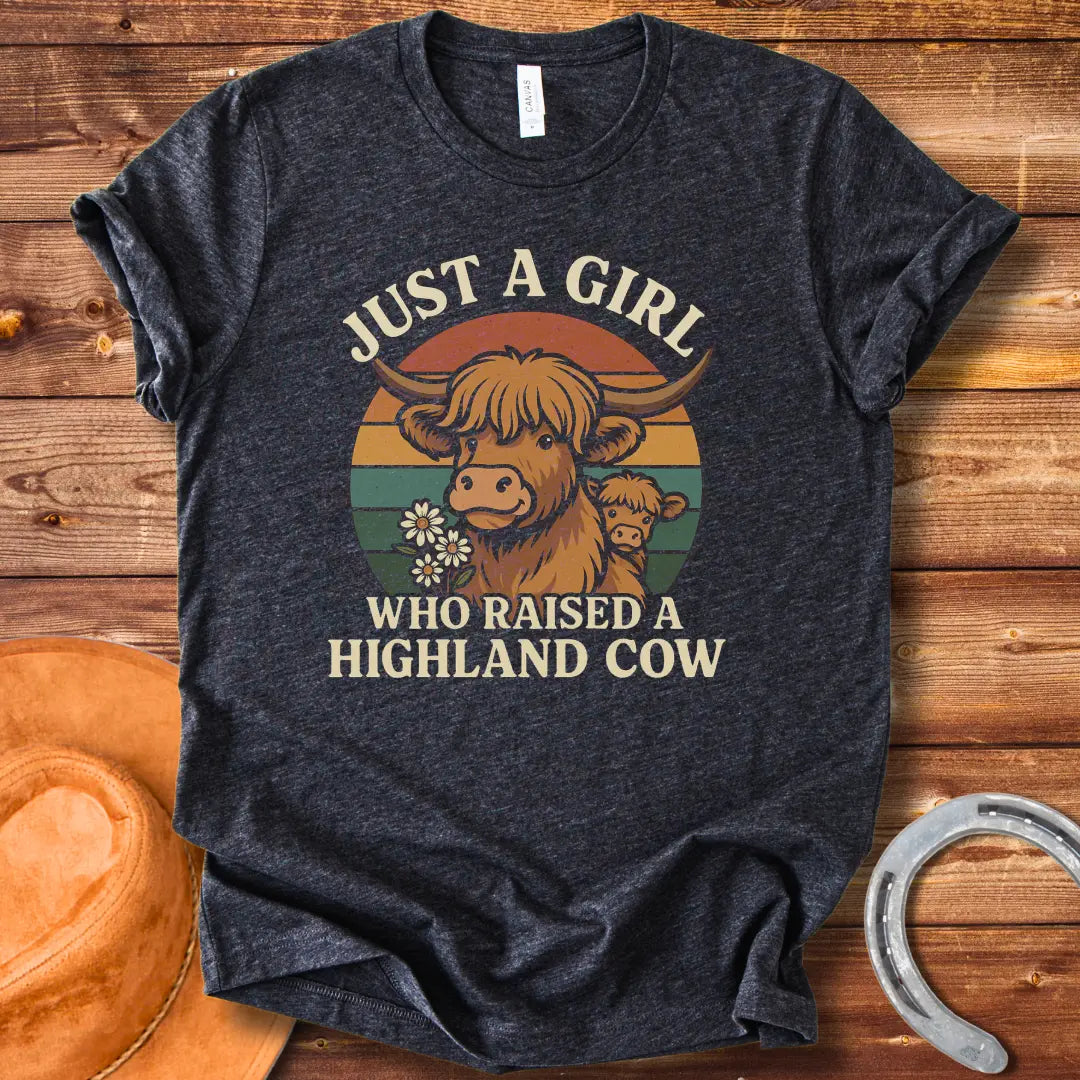 T-shirt design featuring a Highland cow with her calf, the words 'Just a girl who raised a highland cow', and daisies on a vintage sunset background.