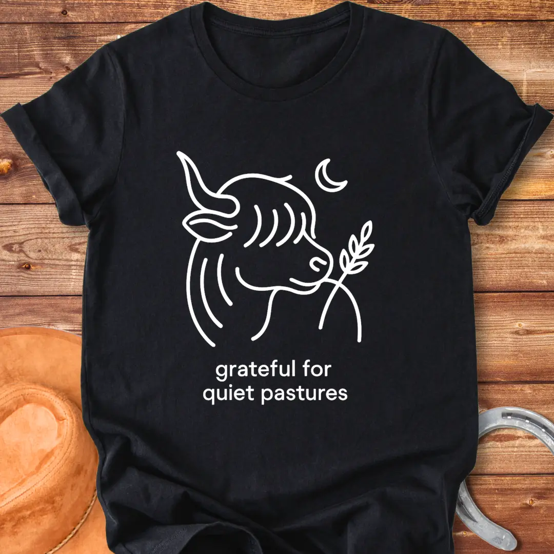 Line art of a Highland cow enjoying a sprig of grass, with the words 'grateful for quiet pastures'