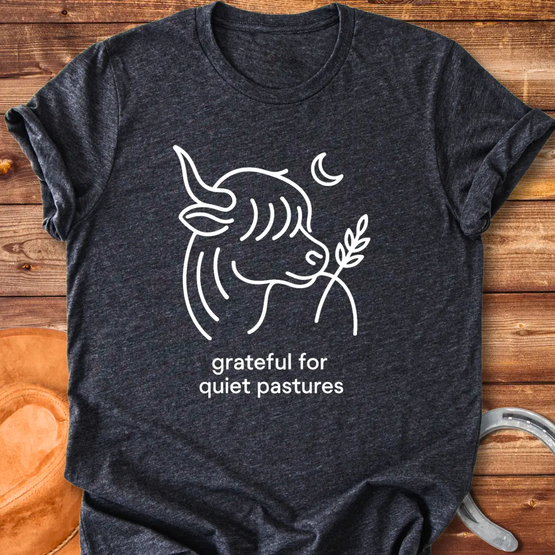 Line art of a Highland cow enjoying a sprig of grass, with the words 'grateful for quiet pastures'