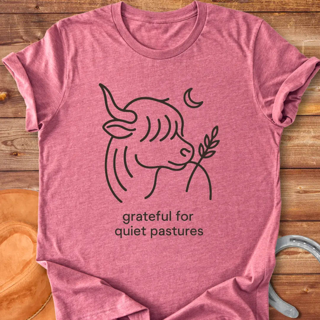 Line art of a Highland cow enjoying a sprig of grass, with the words 'grateful for quiet pastures'