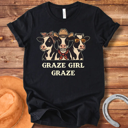 Graze Girl Graze T-Shirt featuring a trio of stylish cows wearing a bandana, a cowboy hat, and sunglasses.