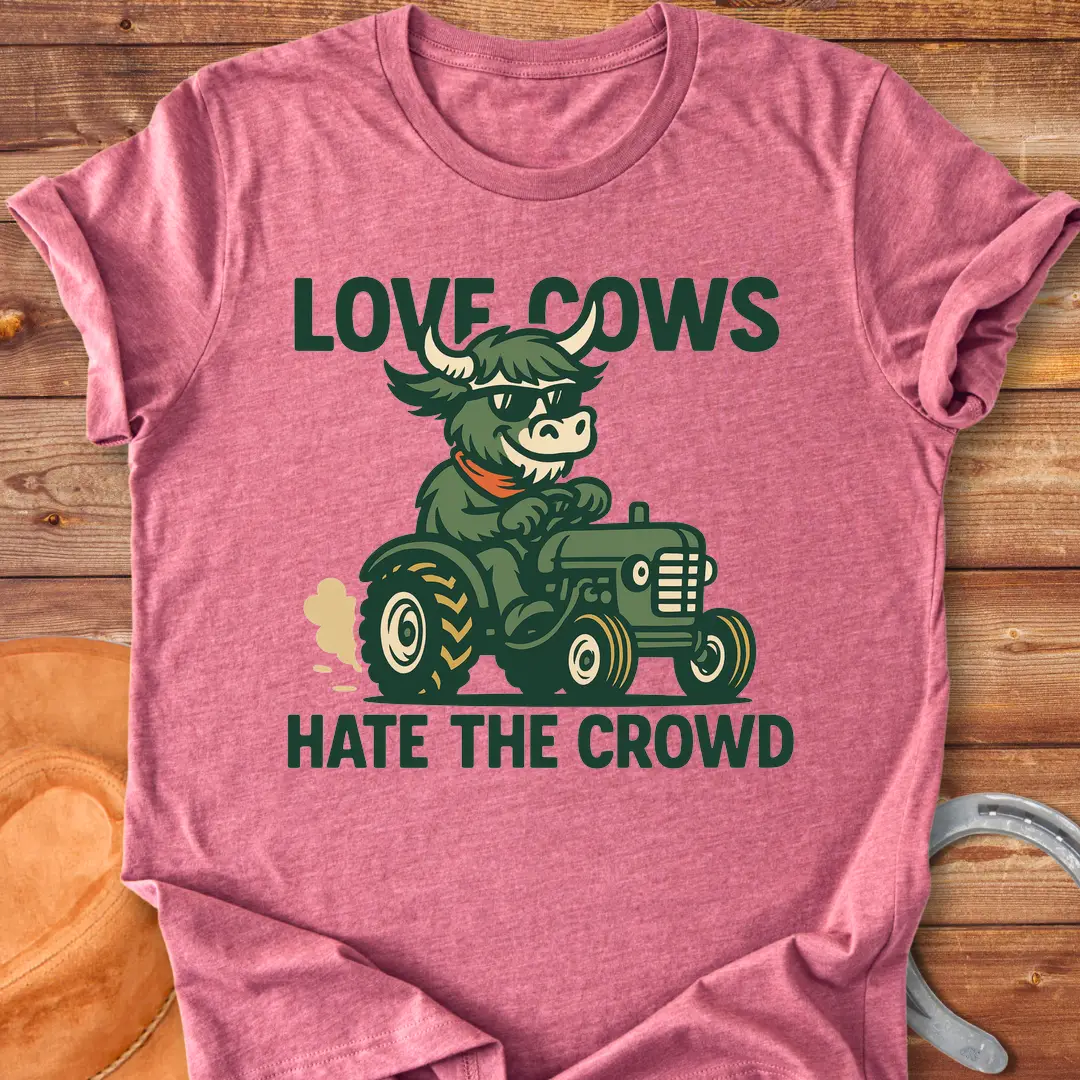 Cool cow in sunglasses driving a tractor, the text says: Love Cows, Hate The Crowd