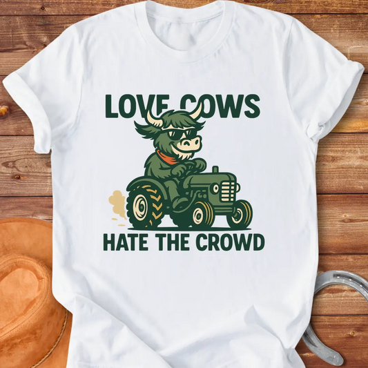 Cool cow in sunglasses driving a tractor, the text says: Love Cows, Hate The Crowd