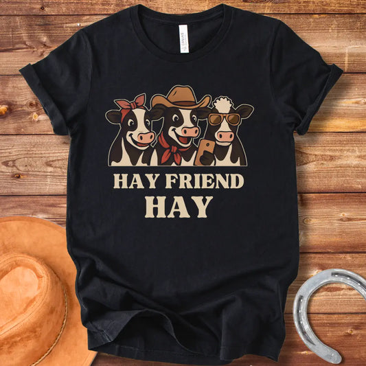 Hay Friend Hay T-Shirt featuring three happy cows with a western look.