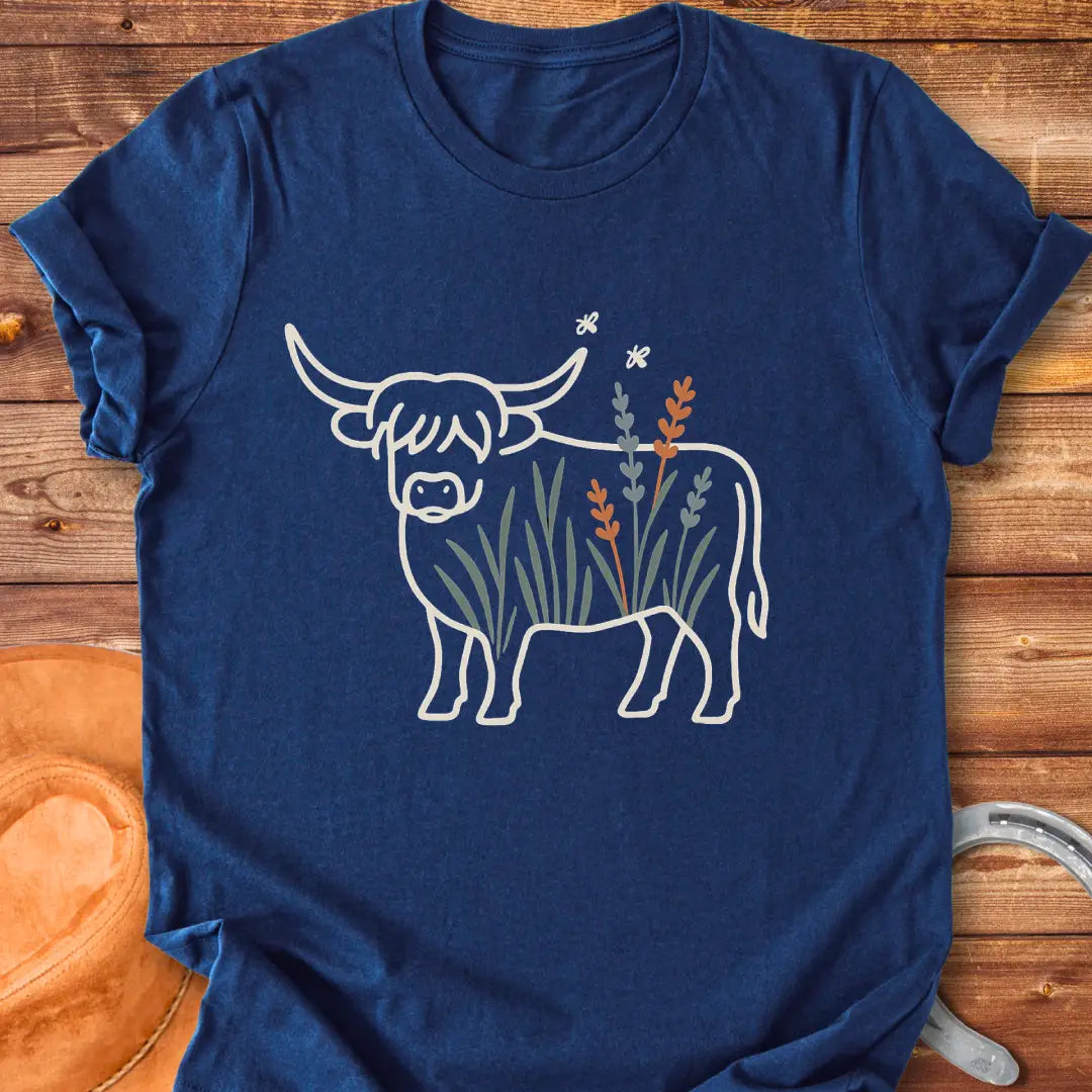 Line drawing of a Highland cow with floral accents on a black background.