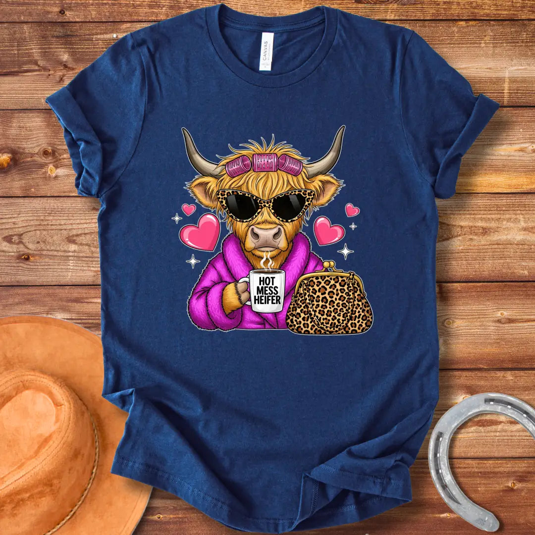 Cartoon image of a cow wearing sunglasses and a robe, holding a mug that says 'Hot Mess Heifer', with a leopard print purse and heart illustrations. 